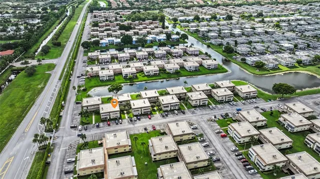 a living room with lots of furniture and a chandelier
