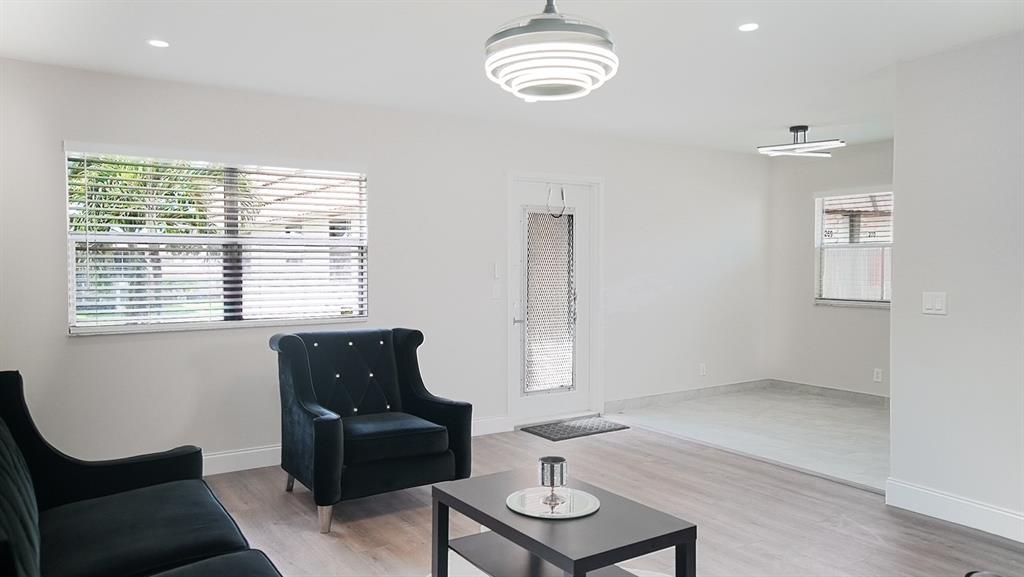 268 Saxony Circle, Unit 268 Delray Beach, FL 33446 - Photo 6 of 28 a living room with furniture and a window