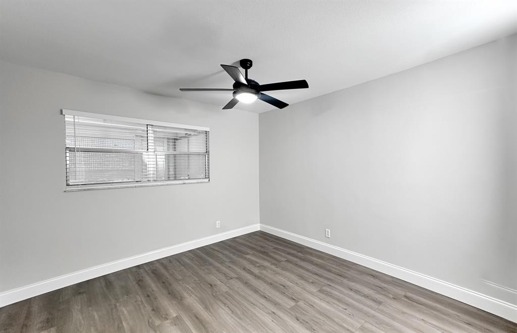 268 Saxony Circle, Unit 268 Delray Beach, FL 33446 - Photo 10 of 28 a view of empty room with wooden floor and fan