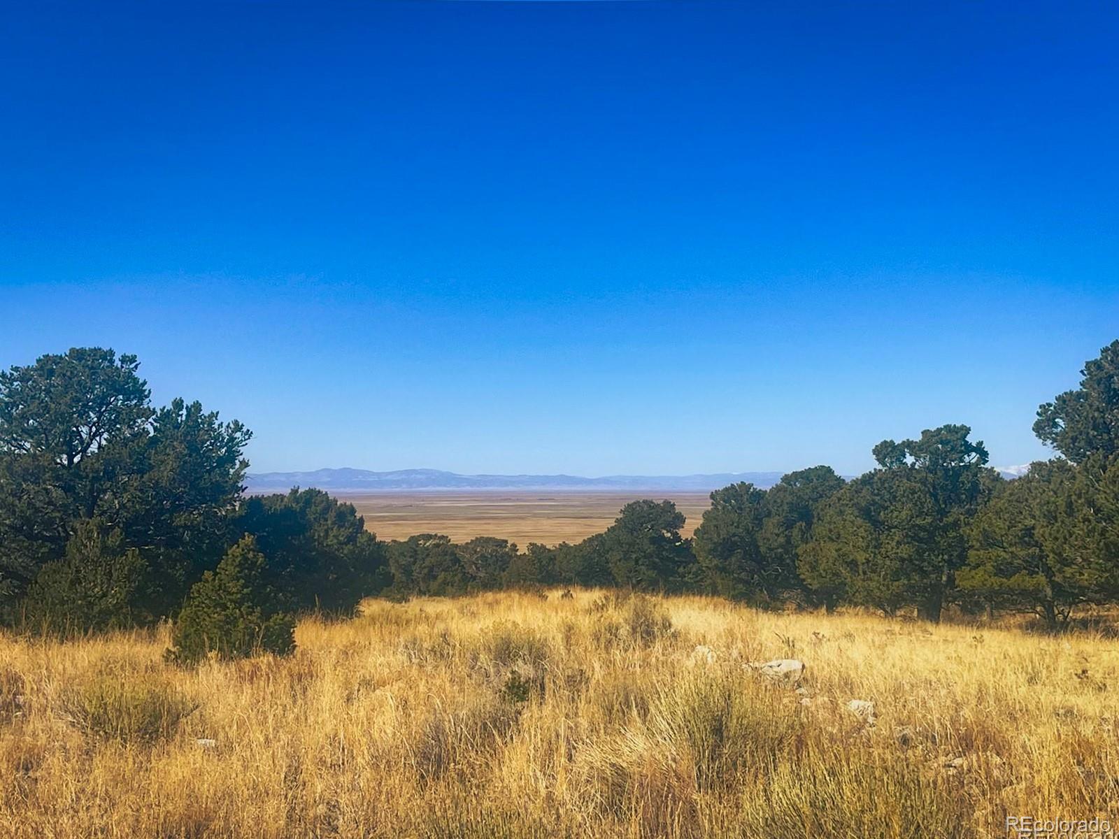 121 Cedar Ridge Road Mosca, CO 81146 - Photo 8 of 9 a view of lake and mountain