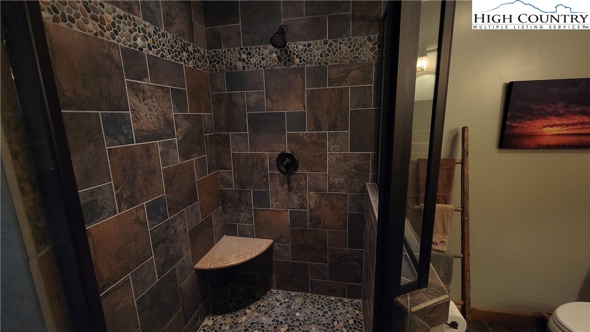 239 Wyndham Way Boone, NC 28607 - Photo 16 of 32 a bathroom with a toilet and a shower