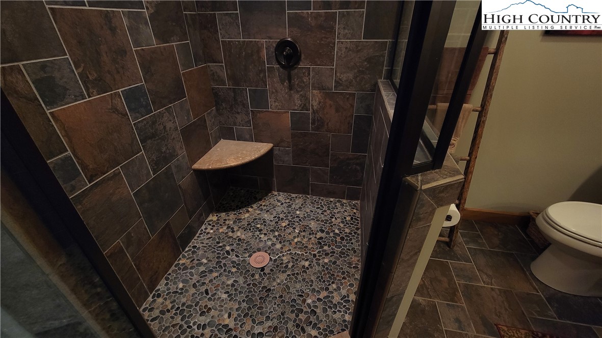 239 Wyndham Way Boone, NC 28607 - Photo 17 of 32 a bathroom with a toilet and a shower