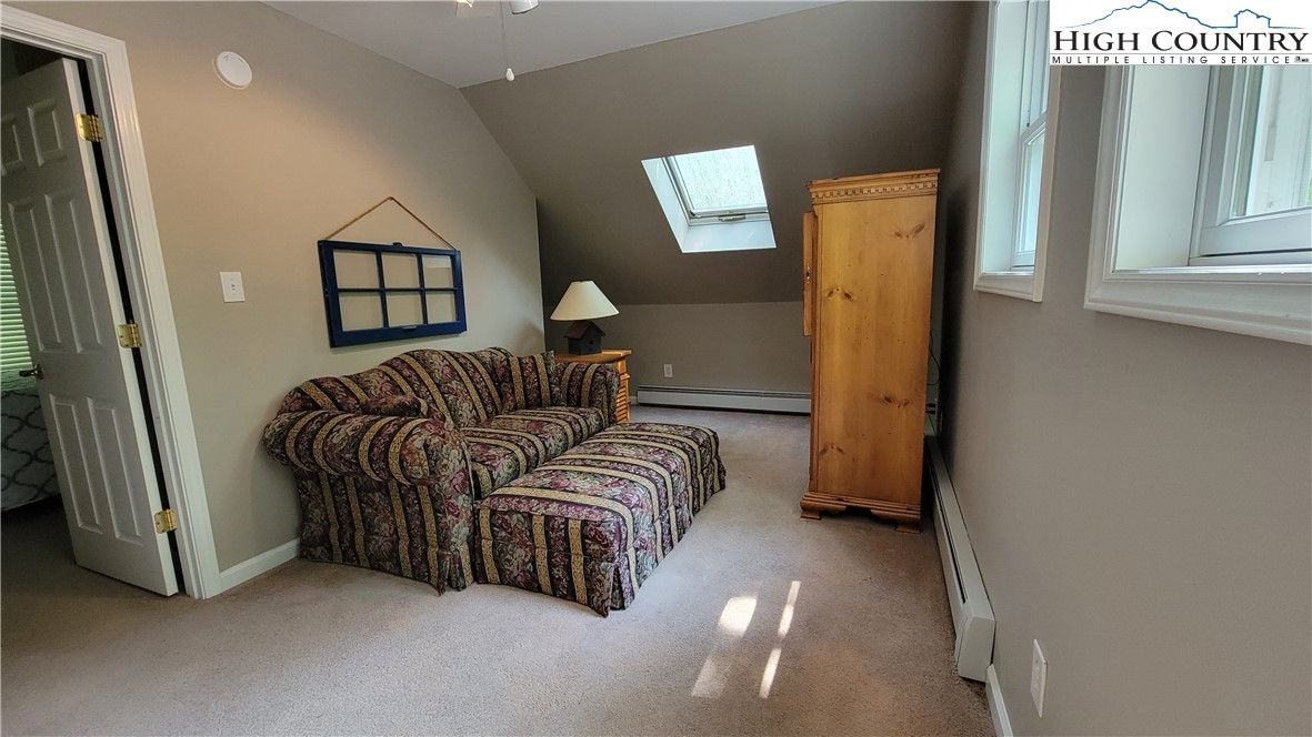 239 Wyndham Way Boone, NC 28607 - Photo 19 of 32 a bedroom with a bed and a window