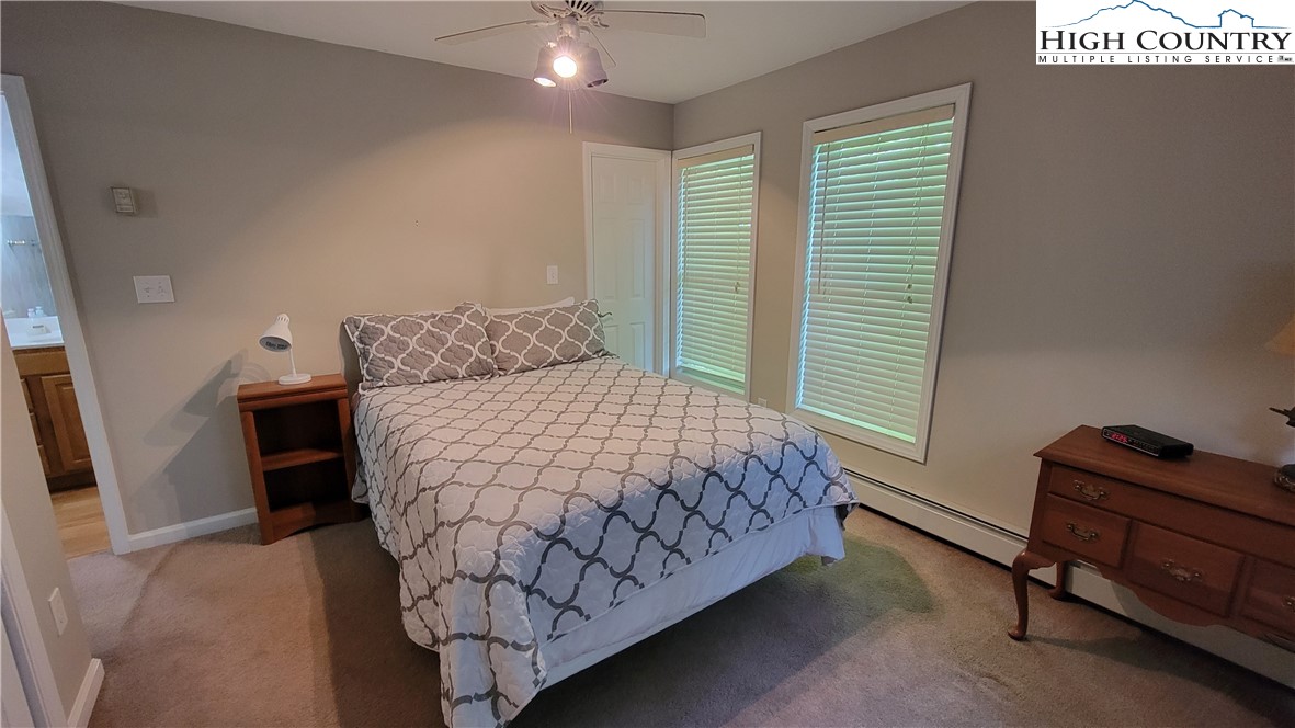 239 Wyndham Way Boone, NC 28607 - Photo 20 of 32 a bedroom with a bed and a window