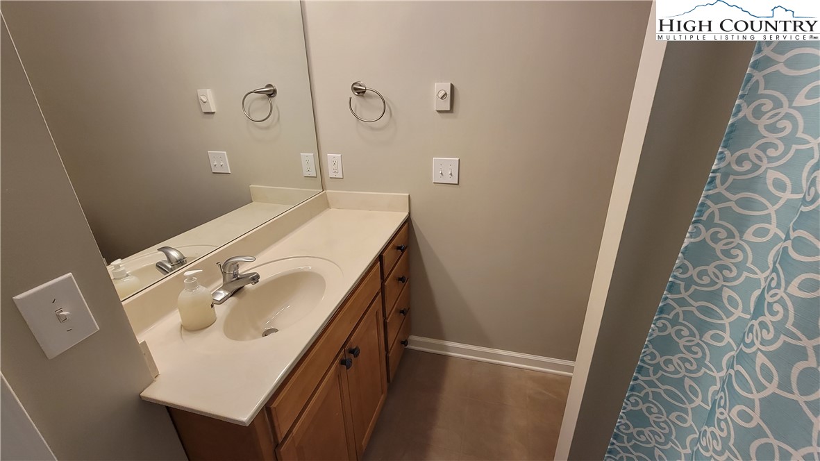 239 Wyndham Way Boone, NC 28607 - Photo 26 of 32 a bathroom with a sink and mirror
