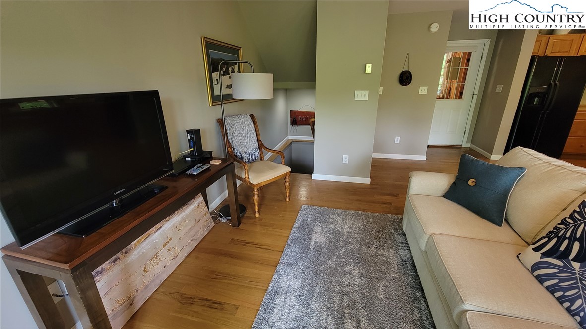239 Wyndham Way Boone, NC 28607 - Photo 5 of 32 a living room with furniture and a flat screen tv