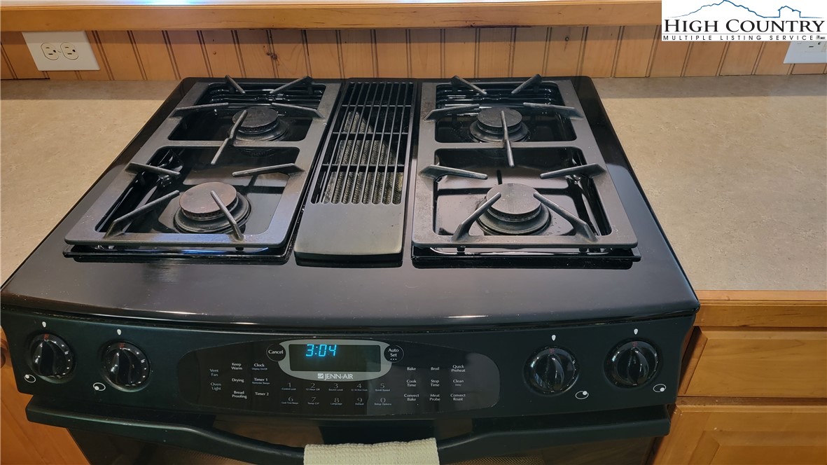 239 Wyndham Way Boone, NC 28607 - Photo 9 of 32 a close view of a stove a microwave and door