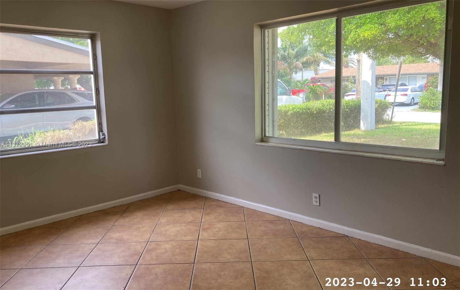 106 Engle Road Lake Worth, FL 33461 - Photo 7 of 10 a view of an empty room with a window