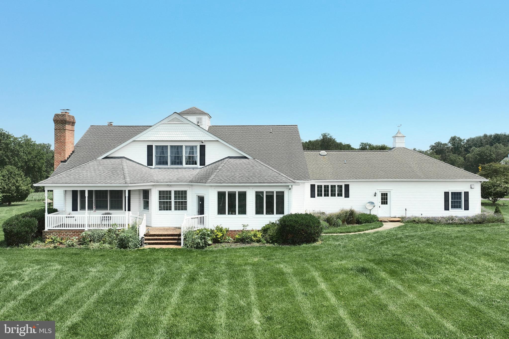 2700 Stockton Road Phoenix, MD 21131 - Photo 2 of 84 a front view of a house with a garden