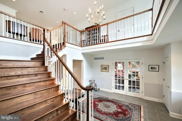 a kitchen with counter top space and dining table wooden floor