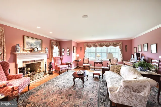 a room with stainless steel appliances kitchen island granite countertop a table and chairs