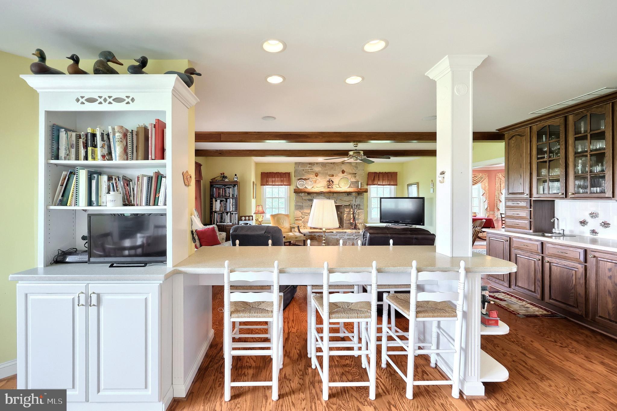 2700 Stockton Road Phoenix, MD 21131 - Photo 35 of 84 a room with stainless steel appliances kitchen island granite countertop a table and chairs