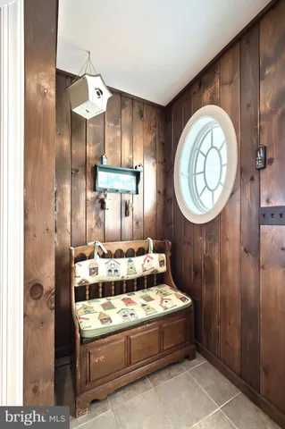 a bathroom with a granite countertop shower sink and mirror