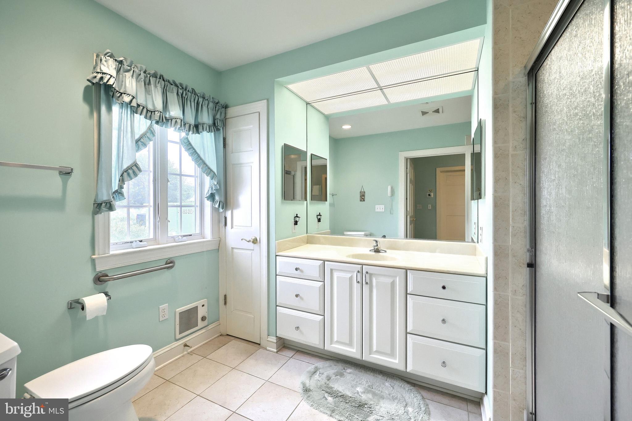 2700 Stockton Road Phoenix, MD 21131 - Photo 49 of 84 a spacious bathroom with a double vanity sink toilet and a mirror