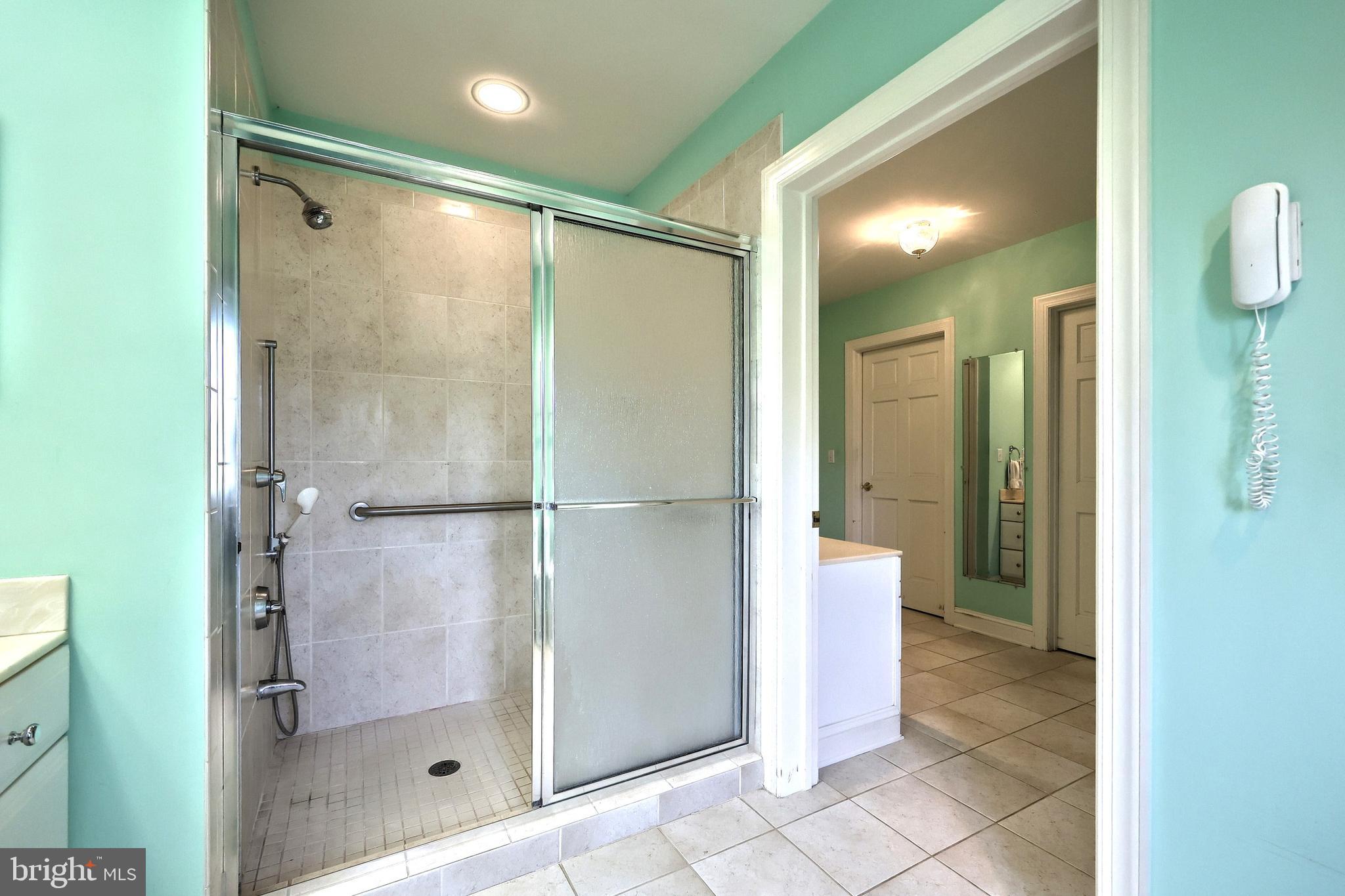 2700 Stockton Road Phoenix, MD 21131 - Photo 50 of 84 a bathroom with a shower and a mirror