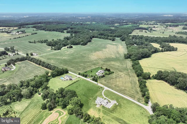 an aerial view of a house with outdoor space
