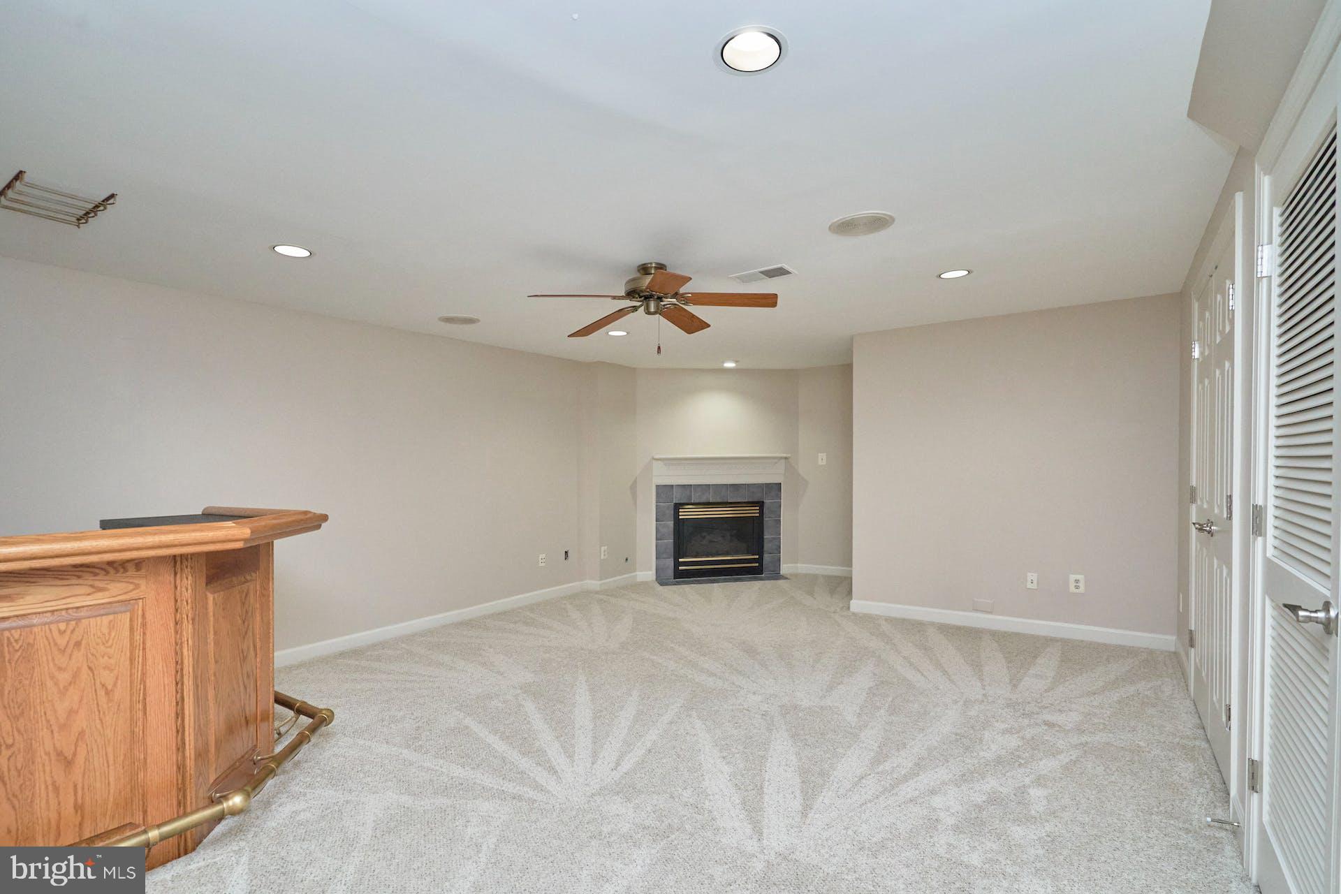 3647 Ransom Place Alexandria, VA 22306 - Photo 26 of 38 Large Recreation Room with Gas Fireplace