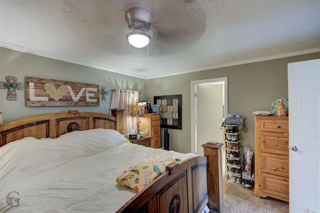 7229 Jennifer Lane Princeton, LA 71067 - Photo 12 of 15 a bedroom with a bed and a tv