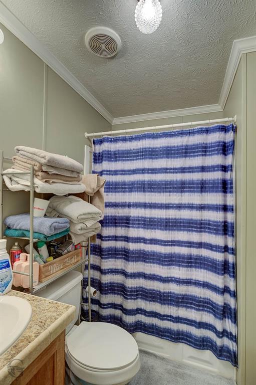 7229 Jennifer Lane Princeton, LA 71067 - Photo 15 of 15 a bathroom with a granite countertop toilet and a sink