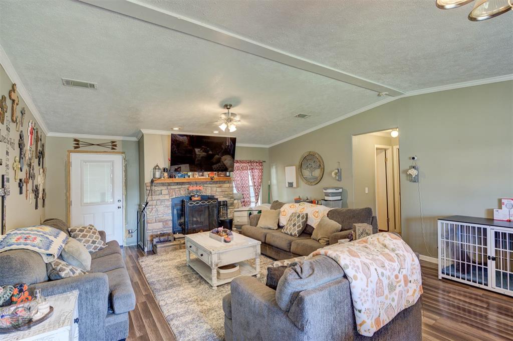 7229 Jennifer Lane Princeton, LA 71067 - Photo 6 of 15 a living room with furniture fireplace and a flat screen tv