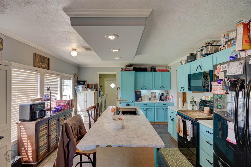 7229 Jennifer Lane Princeton, LA 71067 - Photo 8 of 15 a large kitchen with lots of counter space and furniture