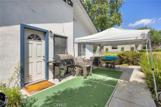a front view of house with yard outdoor seating and green space