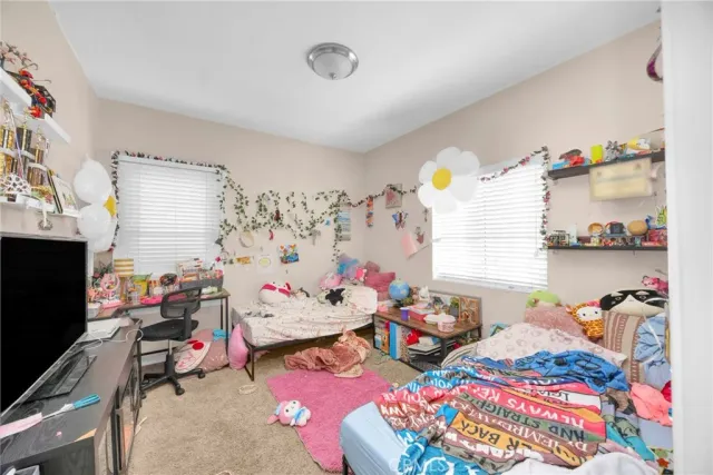 a bedroom with furniture and a bed