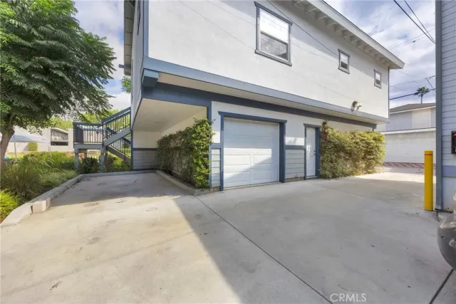 a view of a house with a yard and garage
