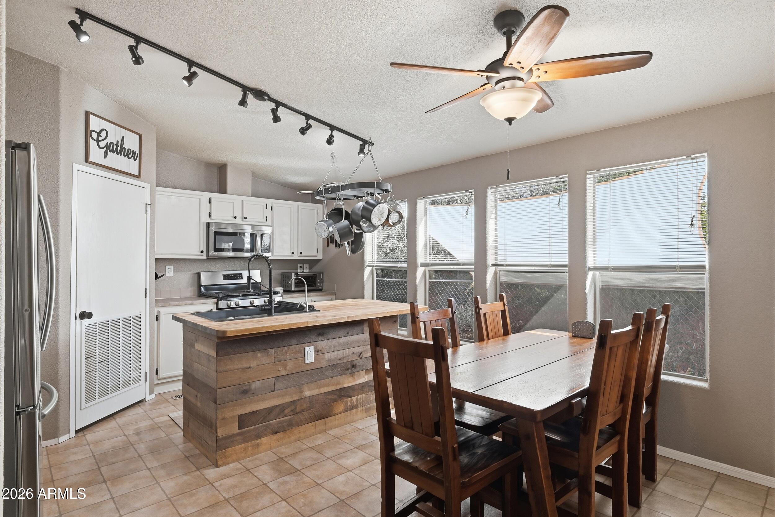 140 East Lariat Drive Payson, AZ 85541 - Photo 11 of 32 a view of a dining room with furniture window and wooden floor