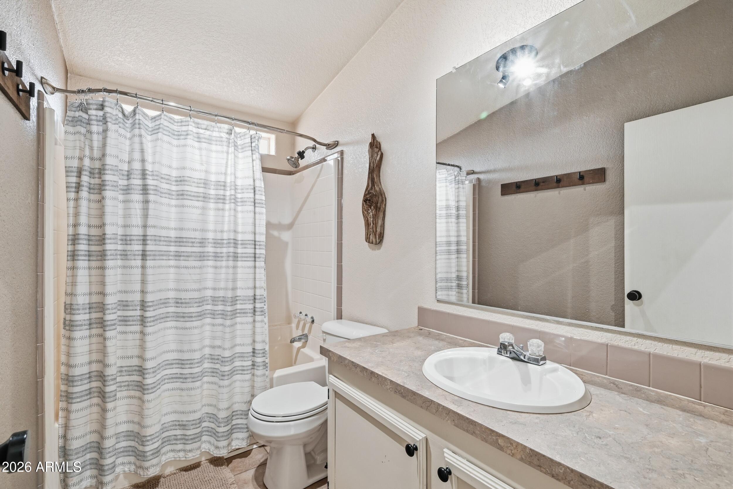 140 East Lariat Drive Payson, AZ 85541 - Photo 22 of 32 a bathroom with a granite countertop sink toilet and shower