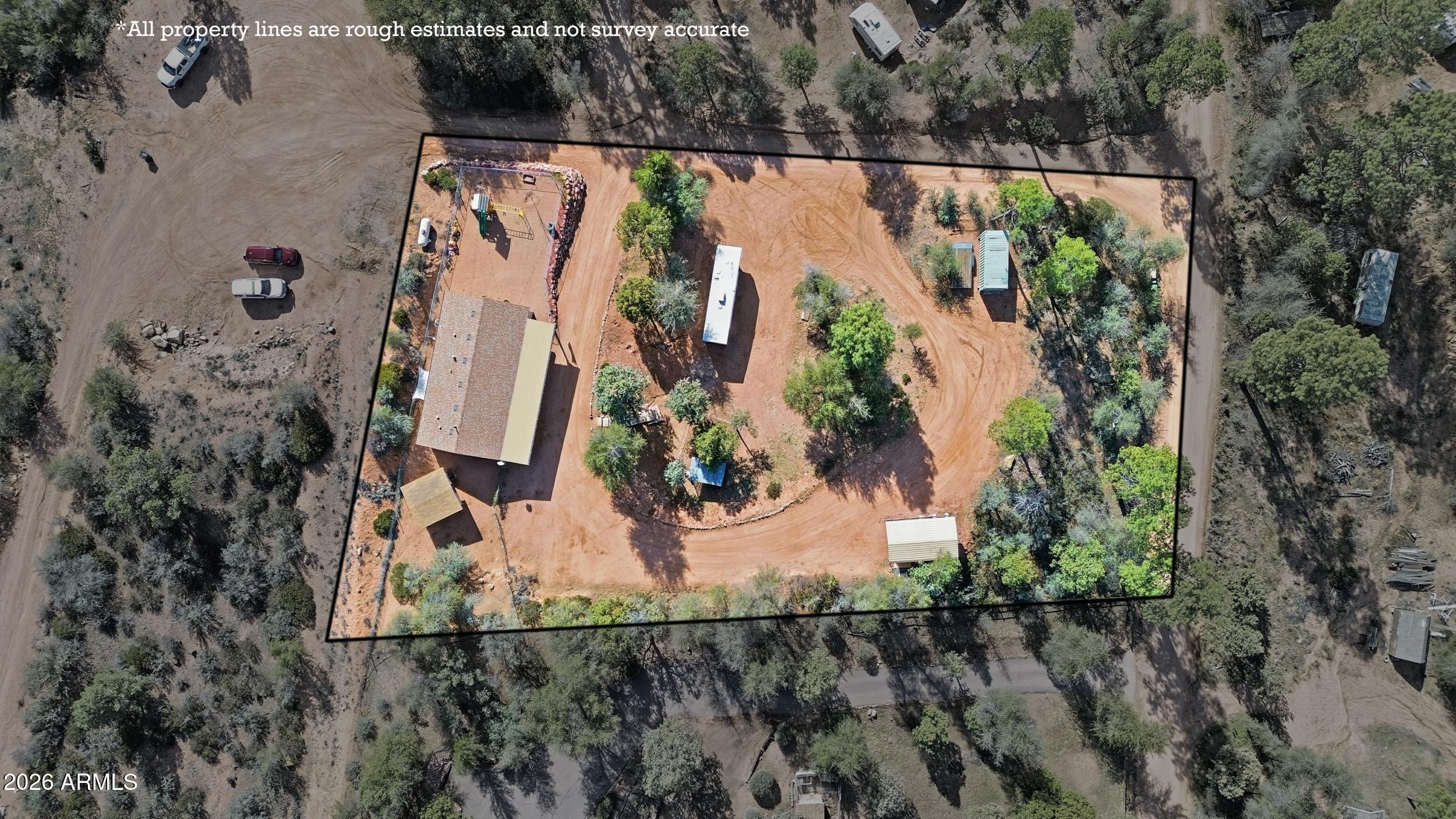 140 East Lariat Drive Payson, AZ 85541 - Photo 3 of 32 an aerial view of a house with a yard and lake view