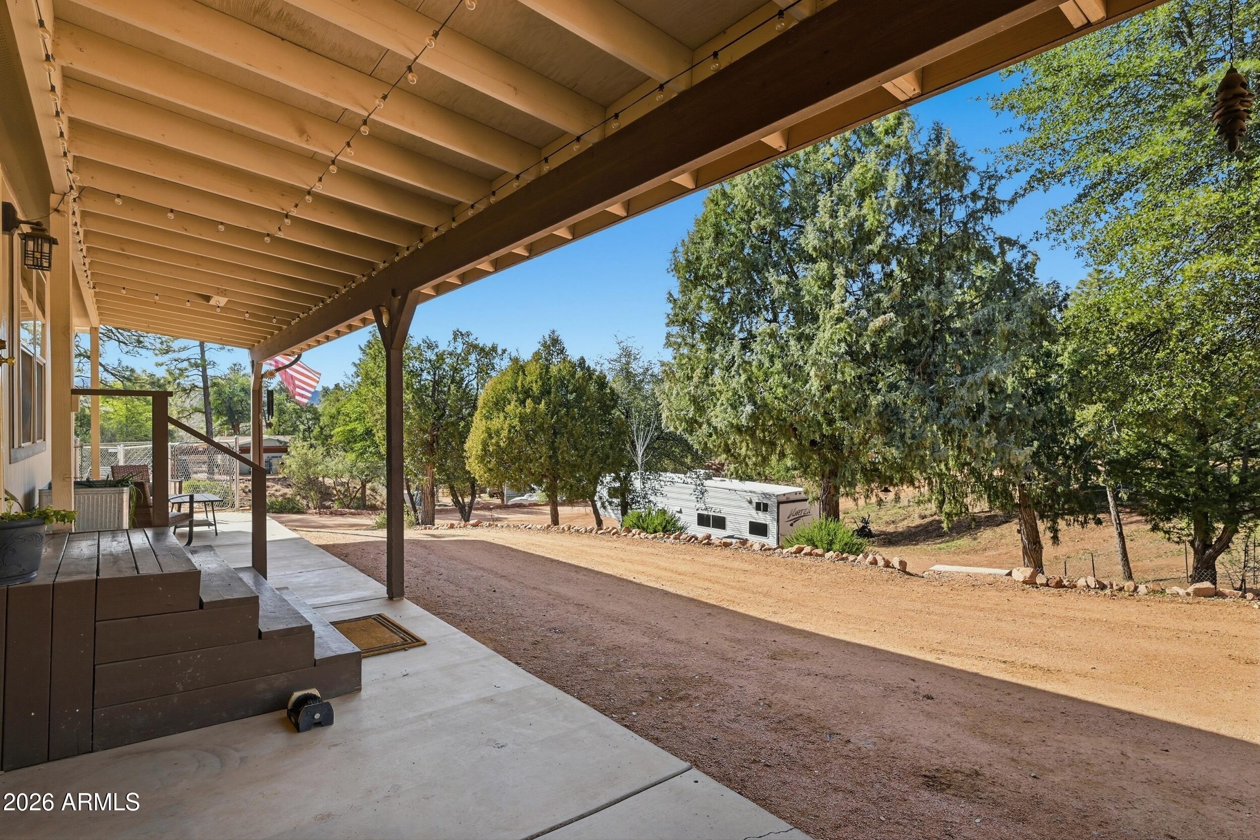 140 East Lariat Drive Payson, AZ 85541 - Photo 5 of 32 a view of a park with swings and table under an umbrella