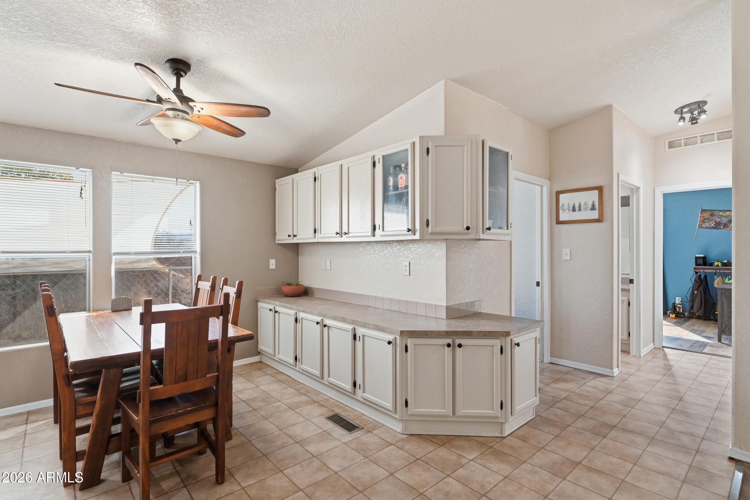 140 East Lariat Drive Payson, AZ 85541 - Photo 10 of 32 a dining room with furniture and window