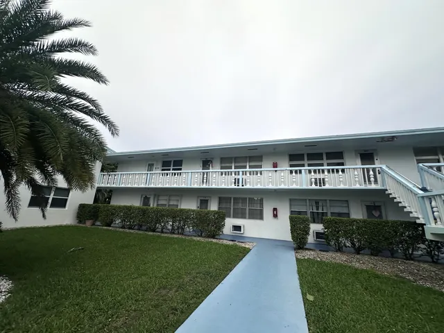 a view of house with a swimming pool