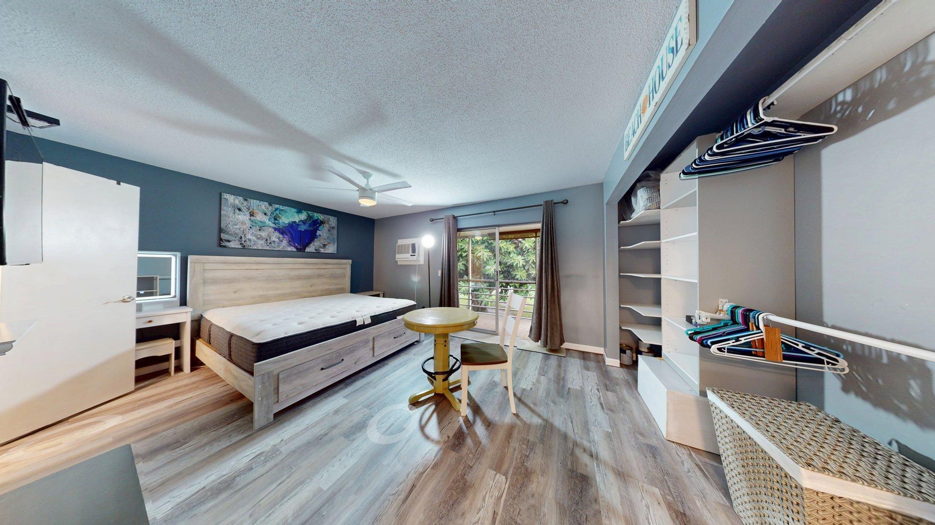 130 Dorchester East, Unit F West Palm Beach, FL 33417 - Photo 13 of 28 a bedroom with furniture and a wooden floor