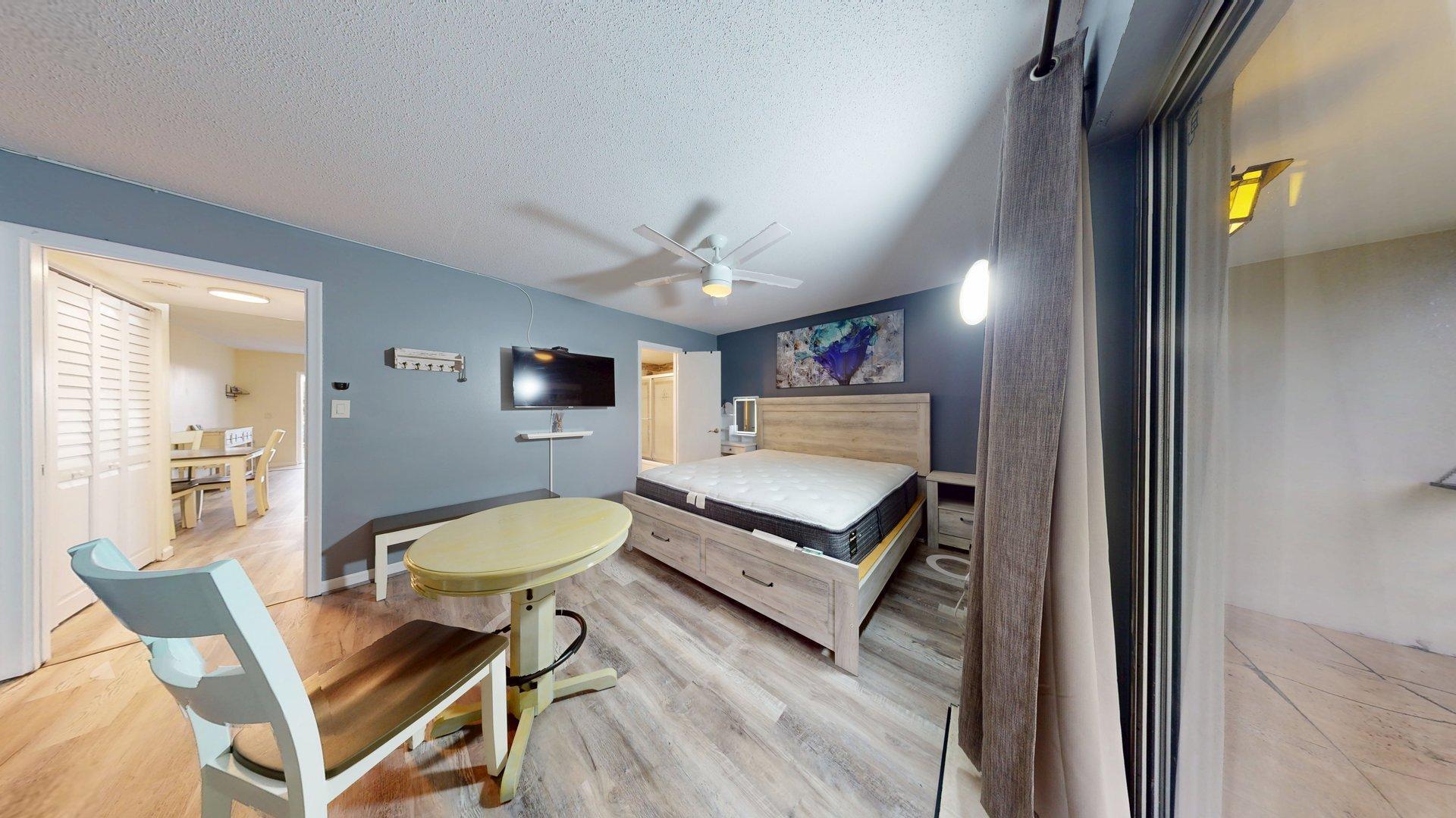 130 Dorchester East, Unit F West Palm Beach, FL 33417 - Photo 16 of 28 a living room with furniture and a wooden floor