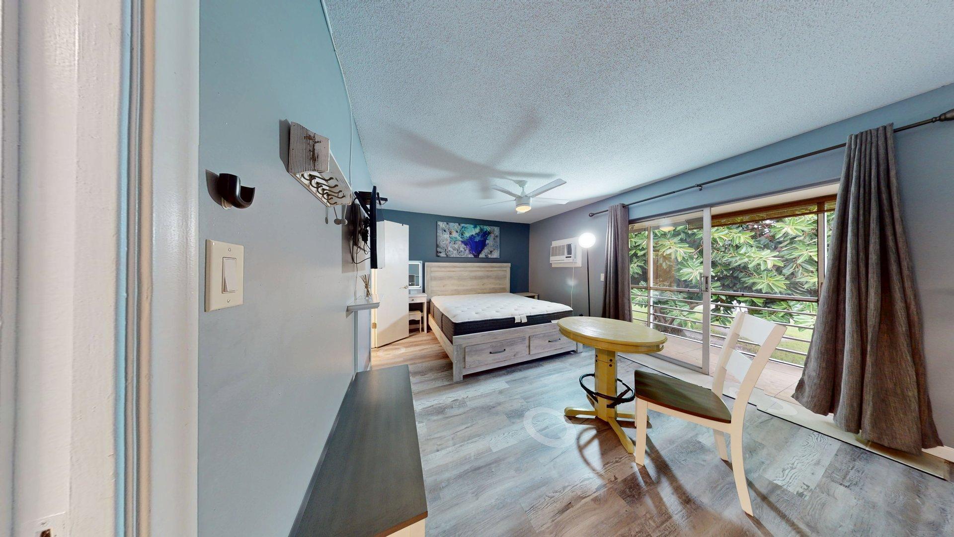 130 Dorchester East, Unit F West Palm Beach, FL 33417 - Photo 21 of 28 a living room with furniture and a large window