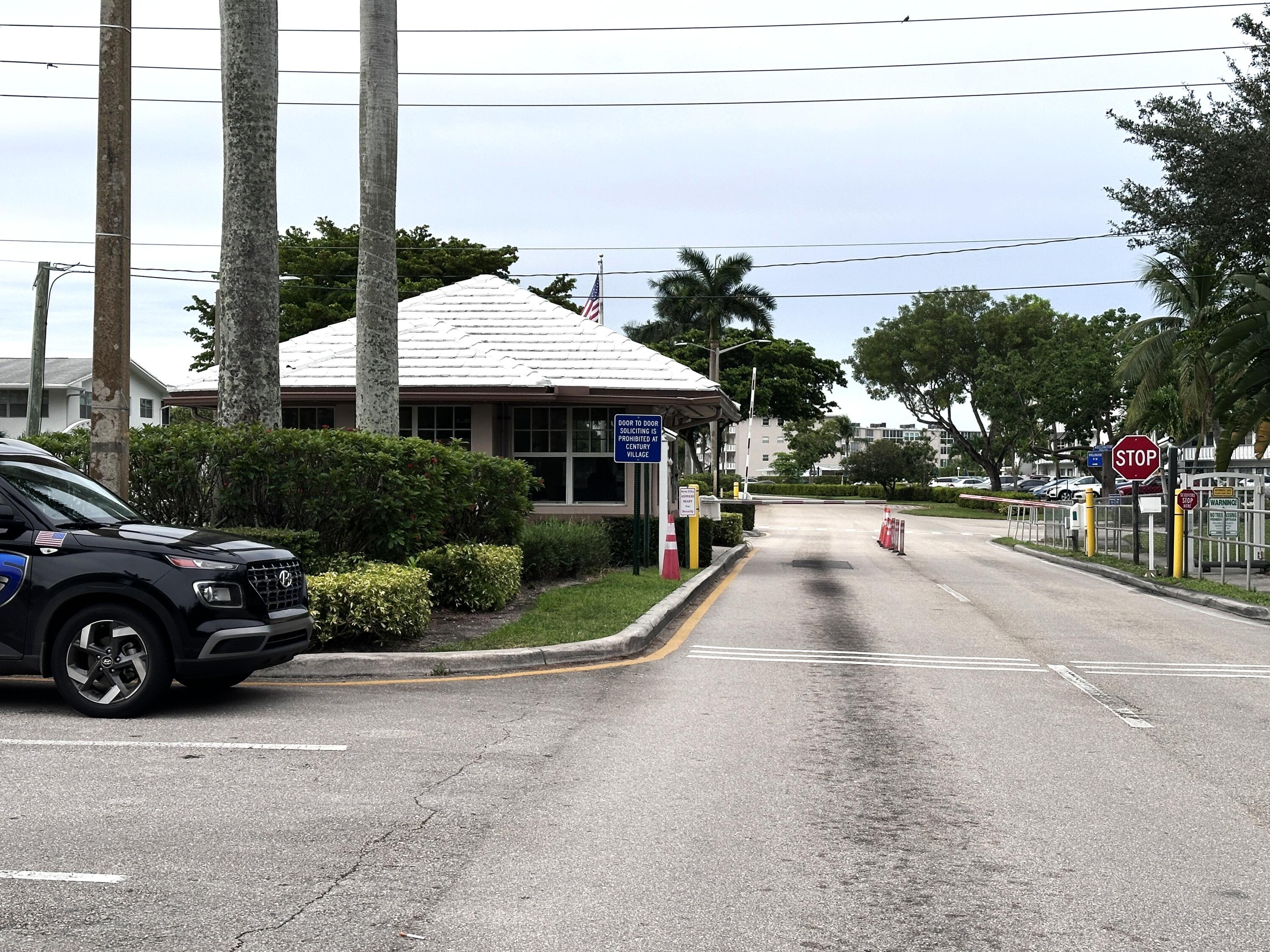 130 Dorchester East, Unit F West Palm Beach, FL 33417 - Photo 3 of 28 a view of a street with cars