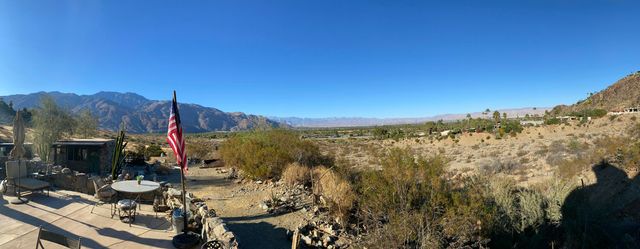a view of a city with mountains in the background