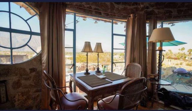 a view of roof with furniture and a window