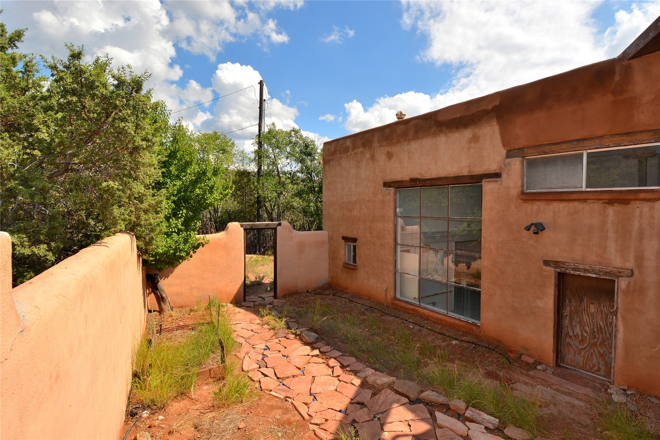 904 Bishops Lodge Road Santa Fe, NM 87501 - Photo 43 of 51 Walkway leading to back garden