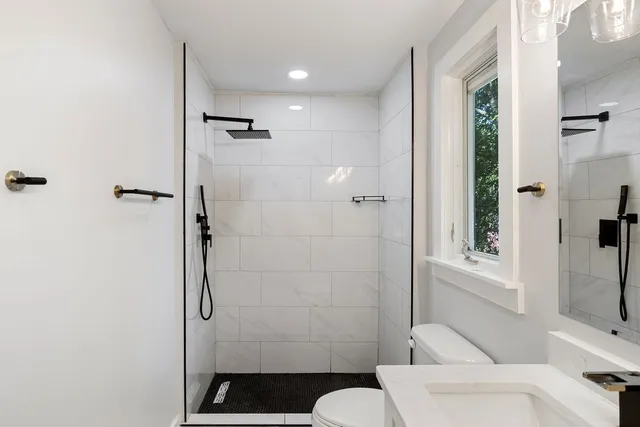 a bathroom with a shower and a toilet