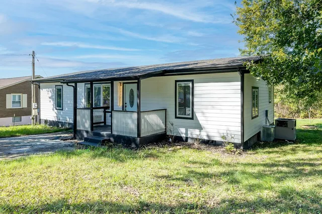 a view of a backyard with a small cabin