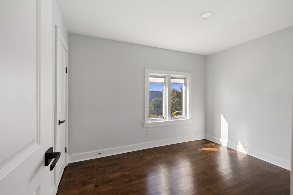1124 Apple Street Lewisburg, TN 37091 - Photo 21 of 24 an empty room with wooden floor and windows