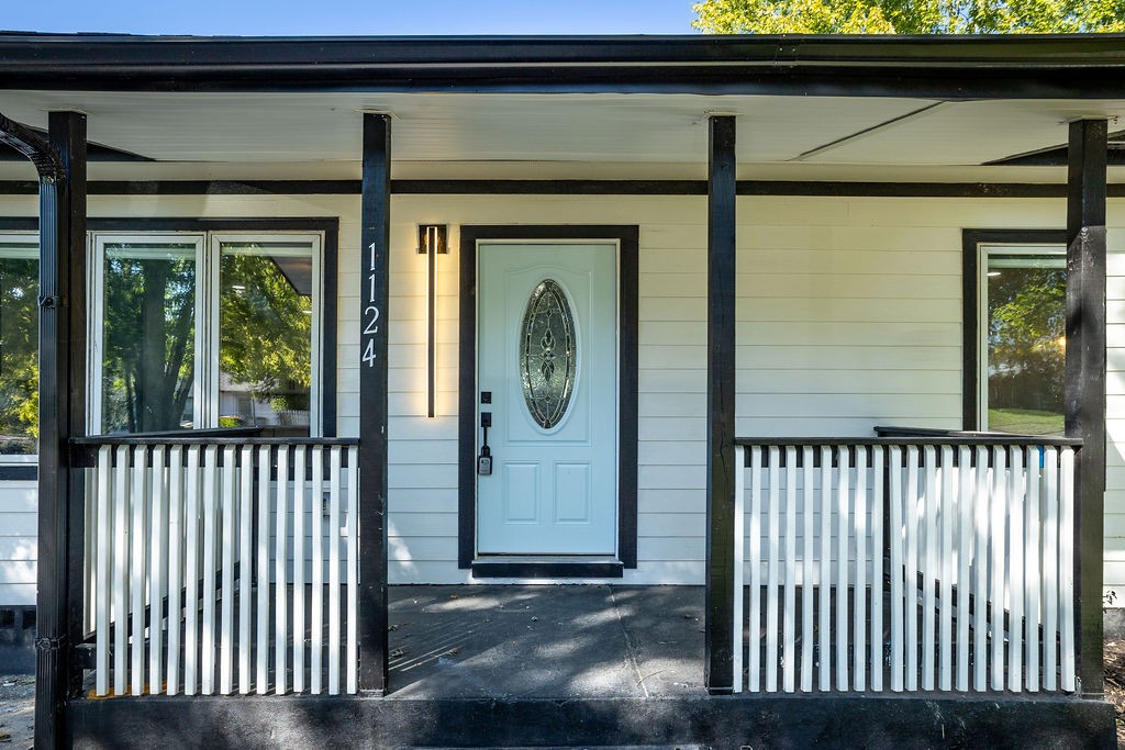 1124 Apple Street Lewisburg, TN 37091 - Photo 4 of 24 a view of a porch with a door and wooden floor