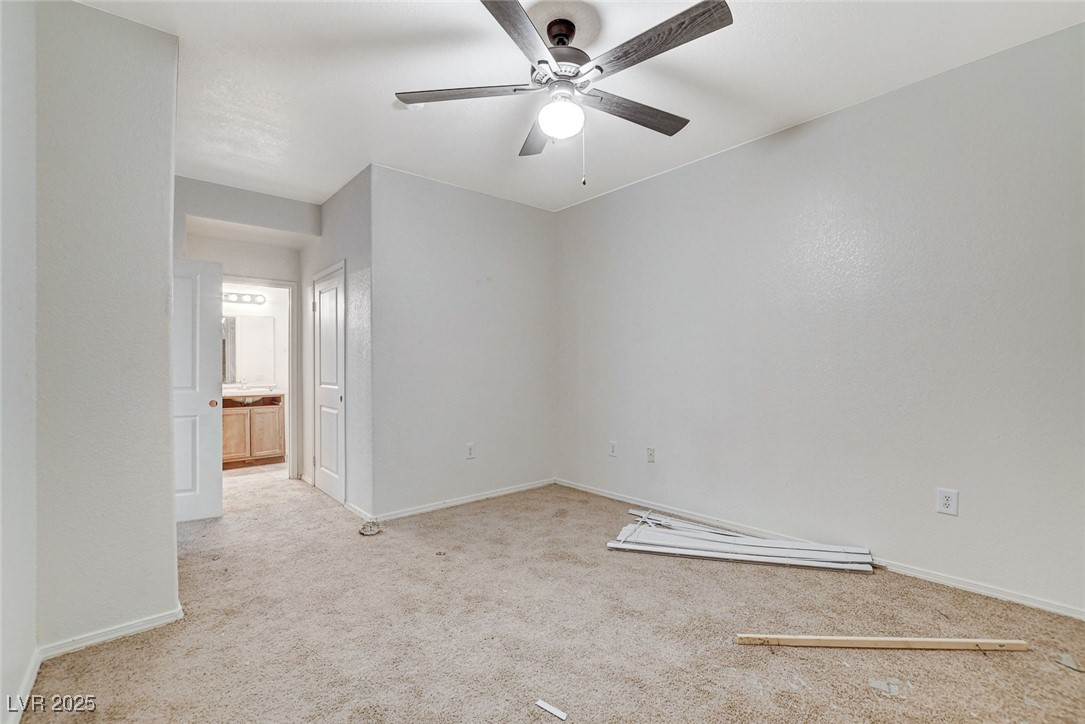 3318 North Decatur Boulevard, Unit 1061 Las Vegas, NV 89130 - Photo 19 of 49 Unfurnished room with light carpet and a ceiling fan