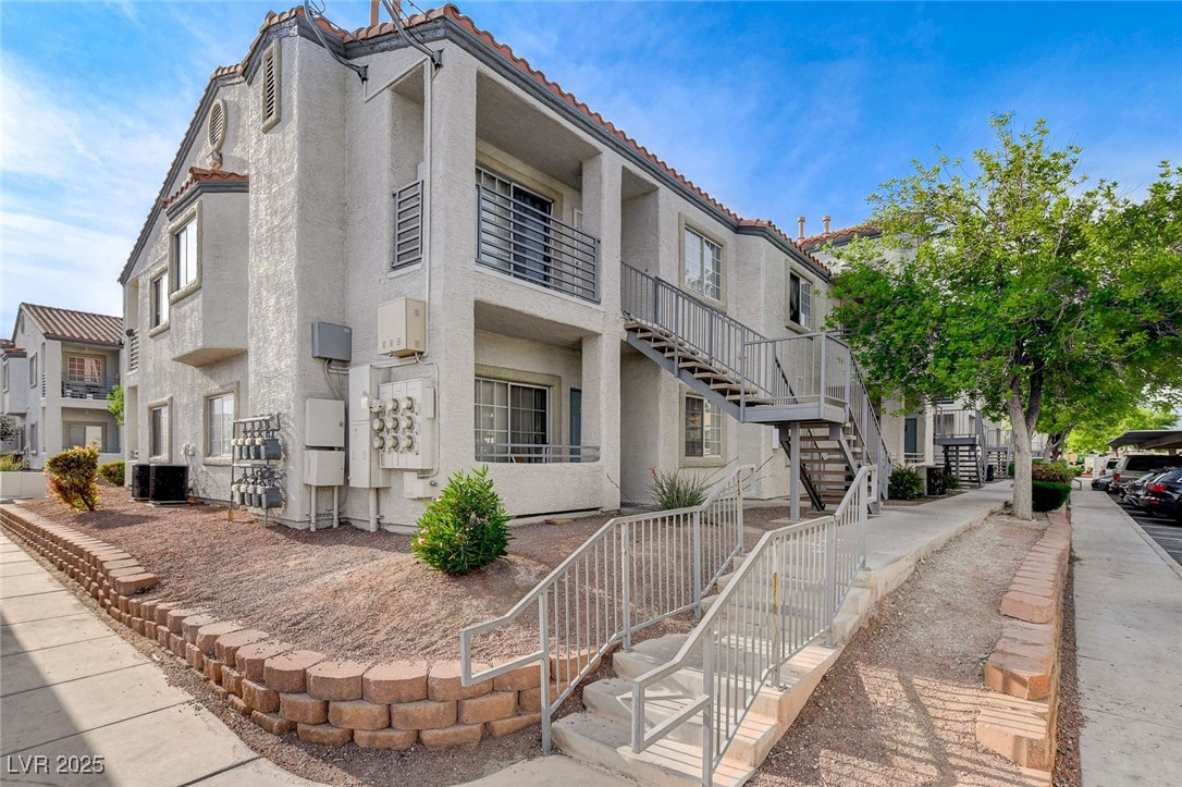 3318 North Decatur Boulevard, Unit 1061 Las Vegas, NV 89130 - Photo 3 of 49 View of property with stairway and a residential view