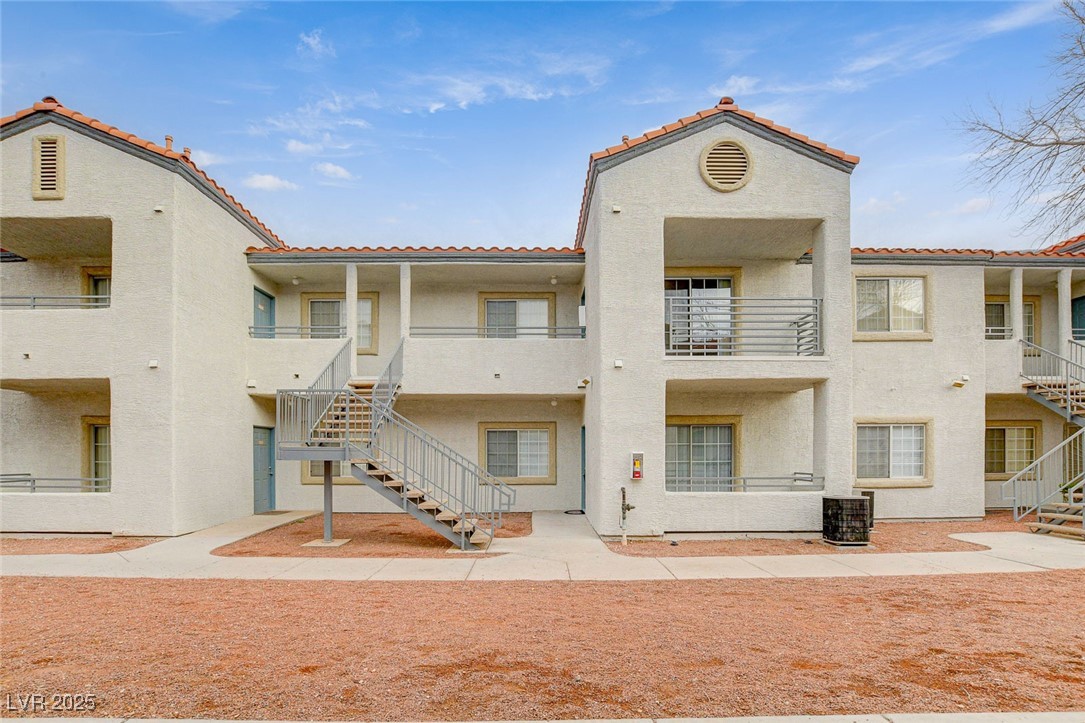 3318 North Decatur Boulevard, Unit 1061 Las Vegas, NV 89130 - Photo 31 of 49 View of building exterior featuring stairway