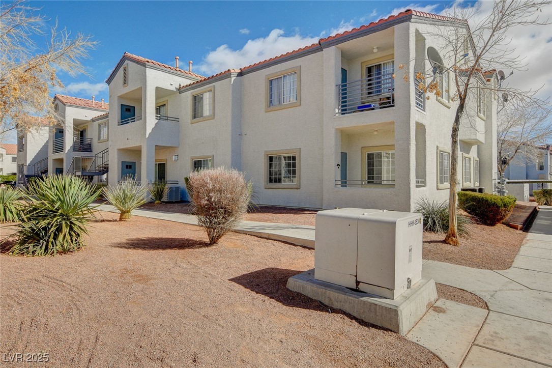 3318 North Decatur Boulevard, Unit 1061 Las Vegas, NV 89130 - Photo 33 of 49 View of building exterior with a residential view