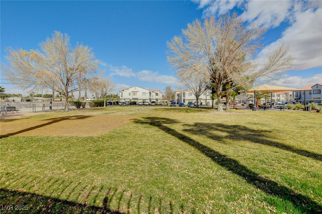 3318 North Decatur Boulevard, Unit 1061 Las Vegas, NV 89130 - Photo 34 of 49 View of home's community featuring a residential view and a lawn